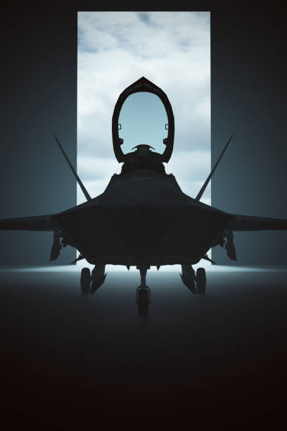 istock Stealth Fighter Jet Aircraft in a Dar Hanger 1268881985