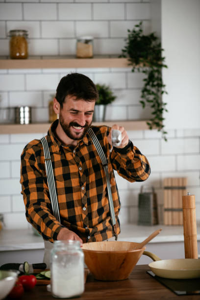 istock Young man preparing delicious food. 1268890706