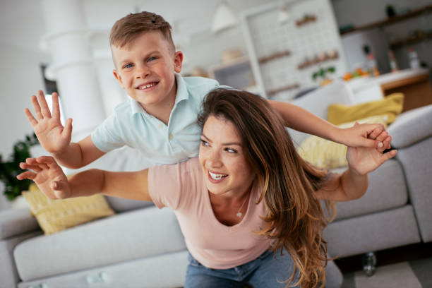 istock Mom and son having fun at home. 1268890889