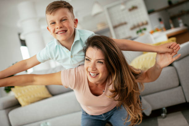 istock Mom and son having fun at home. 1268894550