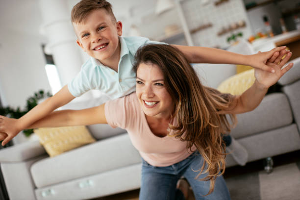 istock Mom and son having fun at home. 1268894558
