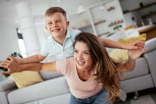 istock Mom and son having fun at home. 1268895839