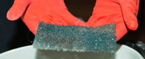 istock The process of cleaning a room with a vacuum cleaner with an aquafilter. Dirty diffuser filter after cleaning and dismantling. 1268896608