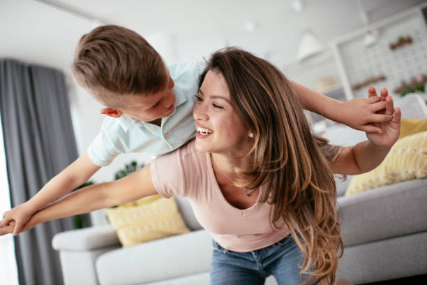 istock Mom and son having fun at home. 1268896889