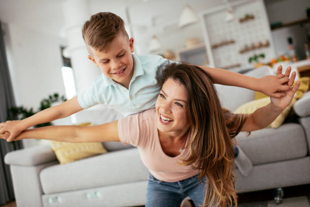 istock Mom and son having fun at home. 1268896892