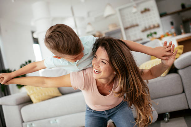 istock Mom and son having fun at home. 1268900703