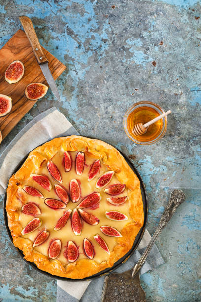 istock Freshly baked fig galette or open fig pie on rustic background 1268900759