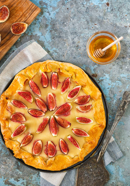 istock Freshly baked fig galette or open fig pie on rustic background 1268900773