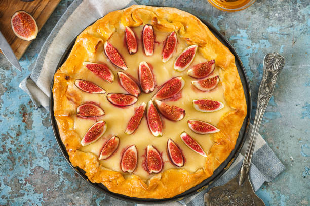 istock Freshly baked fig galette or open fig pie on rustic background 1268900787
