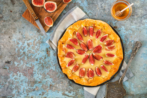 istock Freshly baked fig galette or open fig pie on rustic background 1268900797