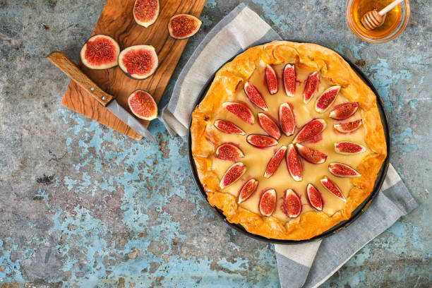 istock Freshly baked fig galette or open fig pie on rustic background 1268900807