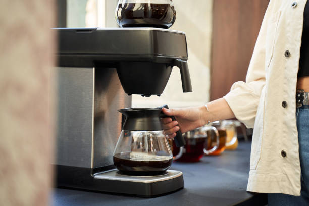 istock Woman taking glass jar with coffee in it 1268901032