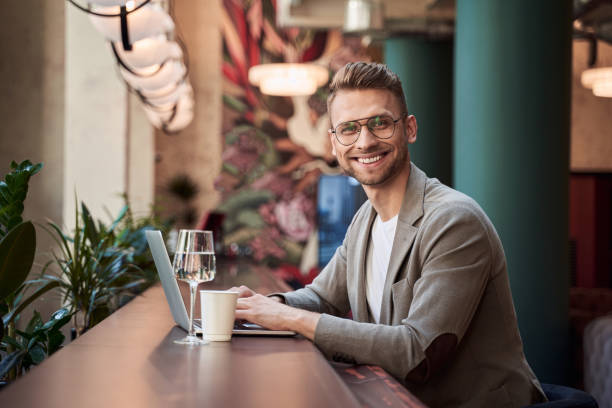 istock Happy young specialist enjoying distant work with modern gadget 1268901559