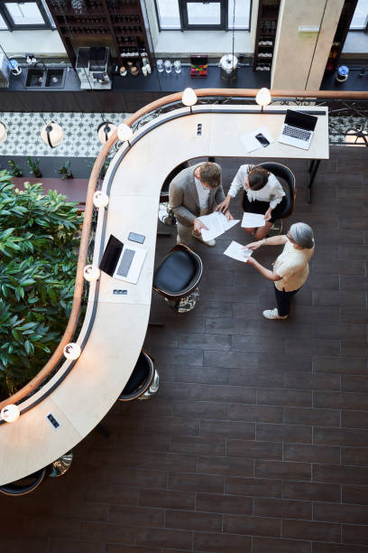istock Two colleagues and their manager are checking paperwork 1268901961