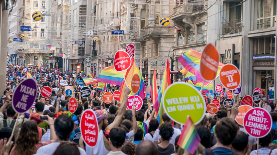 Istanbul, Turkey - June 2013: People in Taksim Square for LGBT pride parade in Istanbul, Turkey. Almost 100.000 people attracted to pride parade and the biggest pride ever held in Turkey.