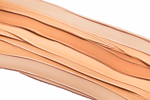 Smudged cosmetic make-up gradient texture palette creamy matte concealer foundation CC or BB-cream powder on white isolated background