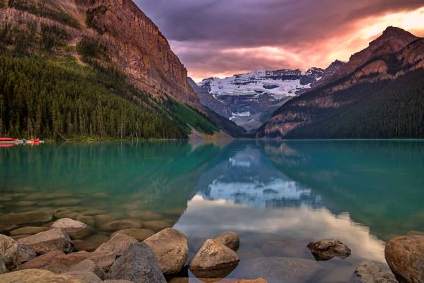 istock Sunrise Clouds Over Lake Louise 1268908502