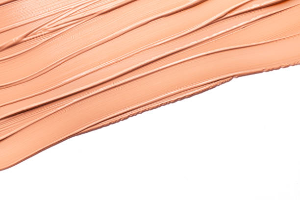 istock Smudged cosmetic make-up gradient texture palette creamy matte concealer foundation CC or BB-cream powder on white isolated background 1268912622