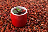 Vitamin tea or tincture from dried rosehip berries. Antioxidant, a tasty and healthy source of vitamin C. It is used in alternative medicine. Selective focus, horizontal orientation