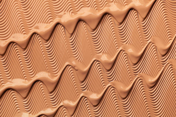 istock Smudged chocolate beige pink cosmetic make-up gradient texture palette creamy matte concealer foundation CC or BB-cream powder 1268913698