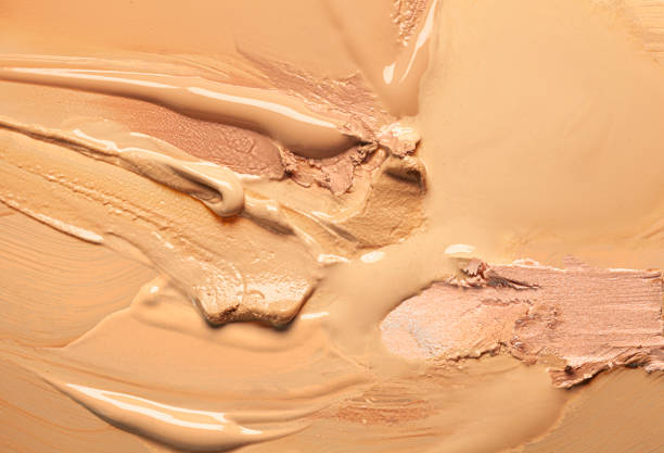istock Smudged chocolate beige pink cosmetic make-up gradient texture palette creamy matte concealer foundation CC or BB-cream powder 1268914717