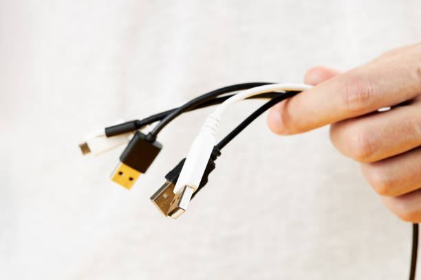 istock person holding stack of a different electric wires. hide computer cables 1268917350