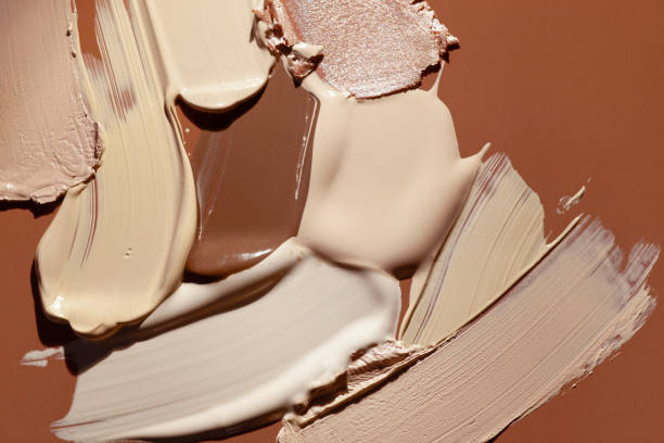 istock Smudged chocolate beige pink cosmetic make-up gradient texture palette creamy matte concealer foundation CC or BB-cream powder 1268917428