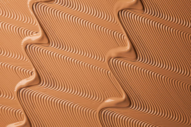 istock Smudged chocolate beige pink cosmetic make-up gradient texture palette creamy matte concealer foundation CC or BB-cream powder 1268918179