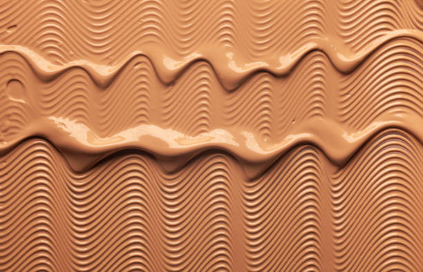 istock Smudged chocolate beige pink cosmetic make-up gradient texture palette creamy matte concealer foundation CC or BB-cream powder 1268918347