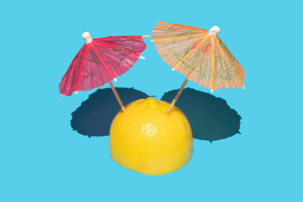 istock Lemon fruit and cocktail umbrella 1268919807