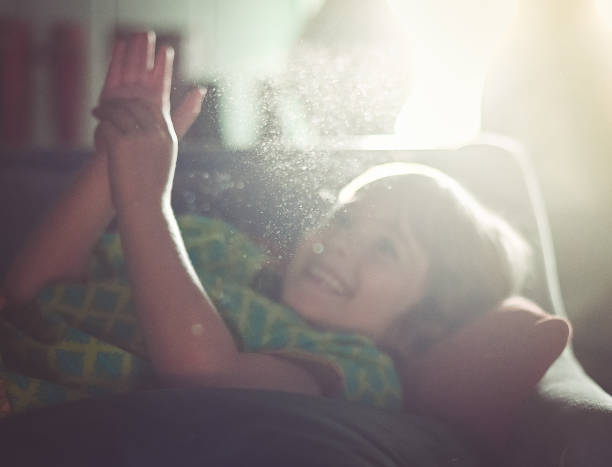 Child at home with dust particles