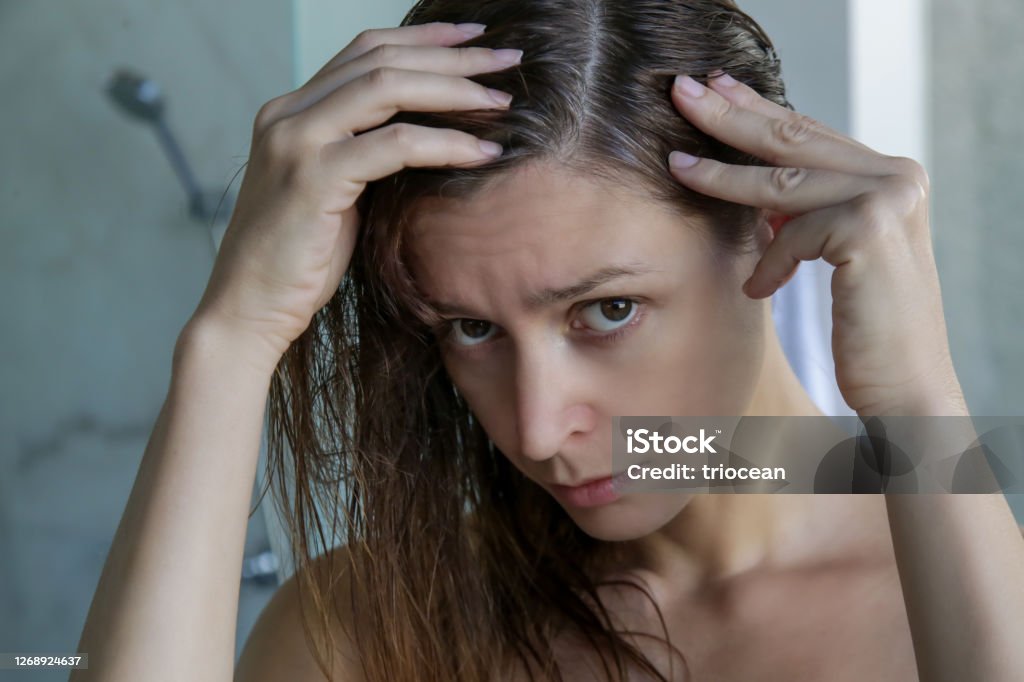 Portrait Of A Beautiful Young Woman Examining Her Scalp And Hair In Front  Of The Mirror Hair Roots Color Grey Hair Hair Loss Or Dry Scalp Problem  Stock Photo - Download Image