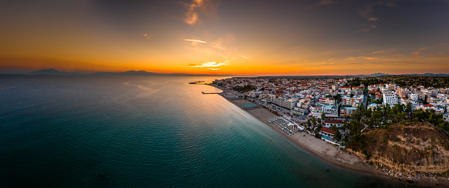 Panoramic aerial photo of the town and port of Nea Kallikrateia, Thessaloniki, Halkidiki Peninsula at summer at dusk