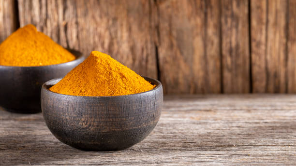 istock Turmeric powder in bowl 1268928306