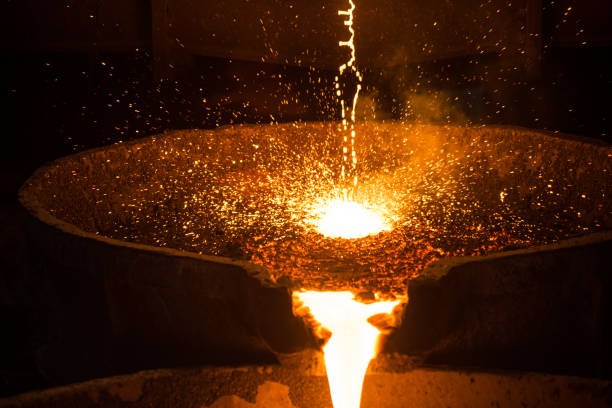 istock Pouring liquid metal from arc furnace 1268931373
