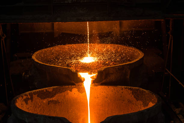 istock Pouring liquid metal from arc furnace 1268932110