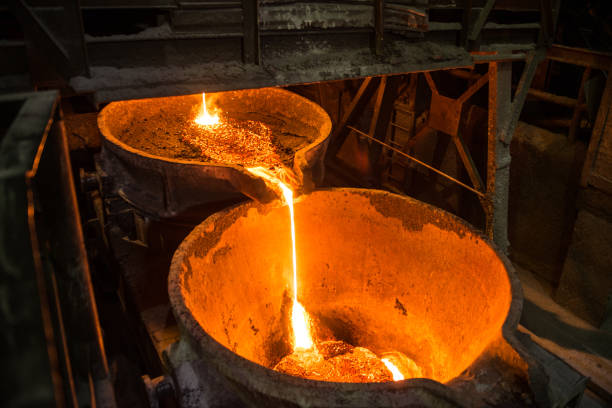istock Pouring liquid metal from arc furnace 1268932111