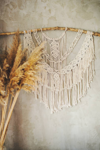 istock Beautiful boho macrame wall panel will add a cozy atmosphere and charm to any space in your home 1268932398
