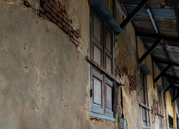 istock Old wooden windows on the old wall. 1268932890