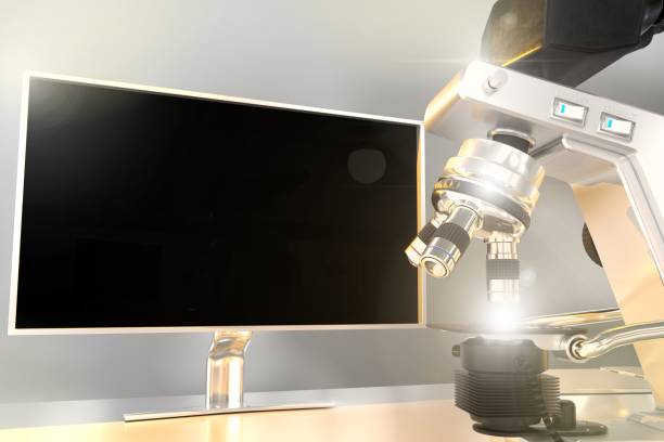 istock biochemistry work concept, lab modern microscope and monitor with blank space for your content with flare on bokeh background - object 3D illustration 1268933085