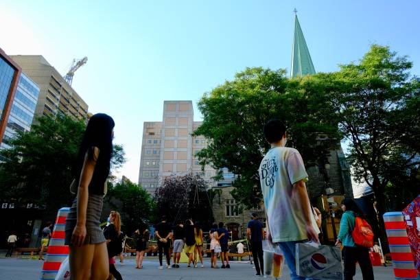 Montreal, Canada - Circa August 2020: Downtown street is opened for pedestrians on weekends from June to September as the city fights against COVID-19 virus.