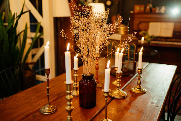 istock table with dry flowers and burning candles 1268944743