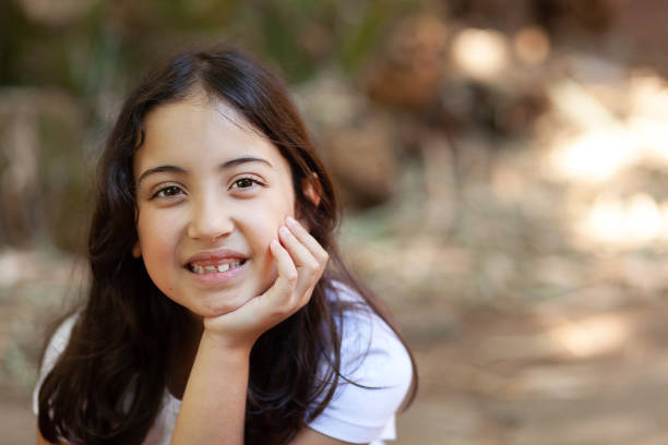 istock Beautiful girl smiling on a sunny day. 1268947691