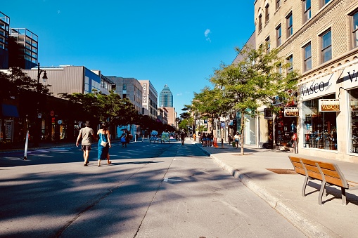 Montreal, Canada - Circa August 2020: Downtown street is opened for pedestrians on weekends from June to September as the city fights against COVID-19 virus.