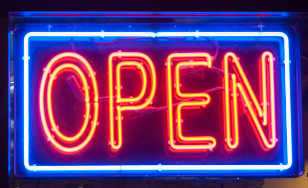 istock Open sign, illuminated in blue and red neon lighting 1268957734
