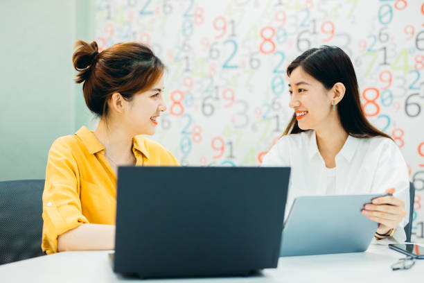 istock Two Businesswomen working together in office. 1268957865