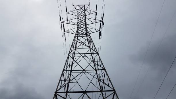 istock metal tower with power or electrical lines and clouds 1268958483