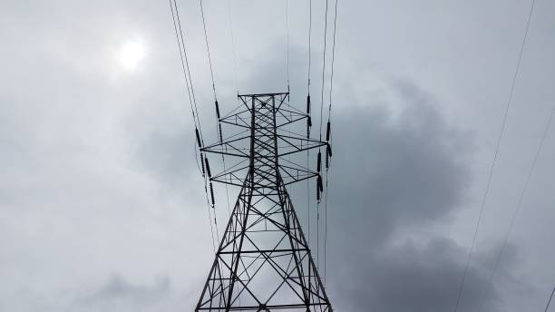 istock metal tower with power or electrical lines and clouds 1268958502