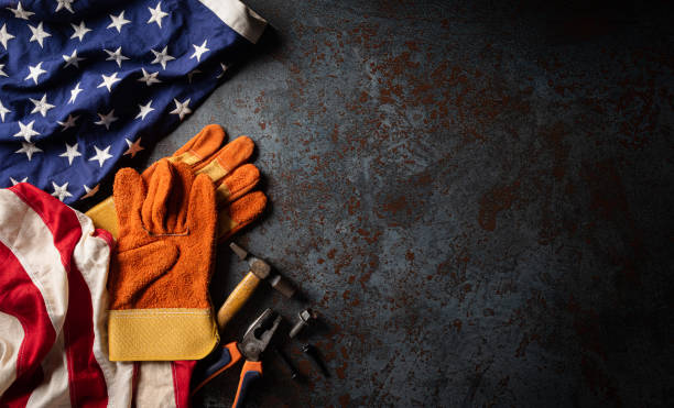 istock Happy Labor day concept. American flag with different construction tools on dark stone background, with copy space for text. 1268958648