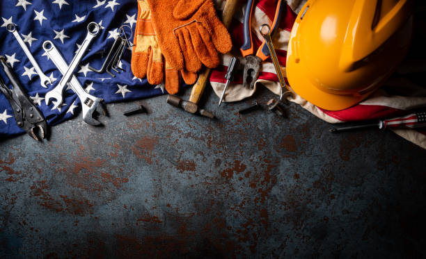 istock Happy Labor day concept. American flag with different construction tools on dark stone background, with copy space for text. 1268958693